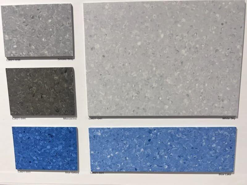 Cross-section diagram of homogeneous solid layer versus heterogeneous multi-layer vinyl sheet flooring structure